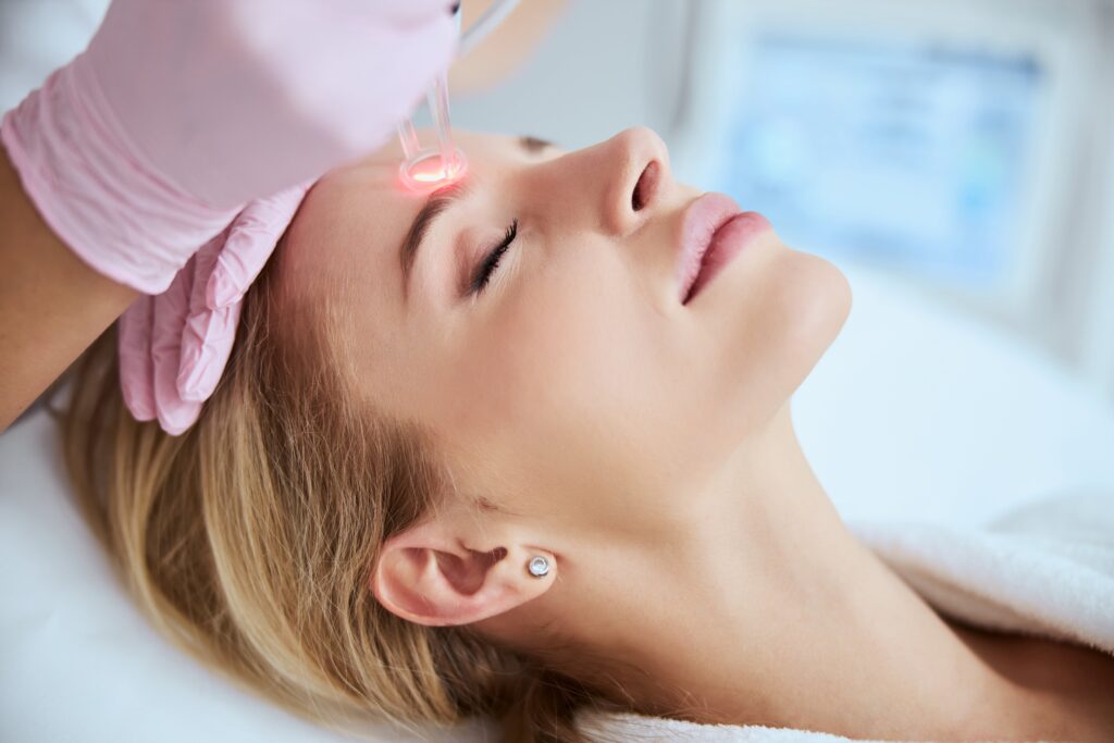 A Moxi laser session performed by a professional to rejuvenate the skin.