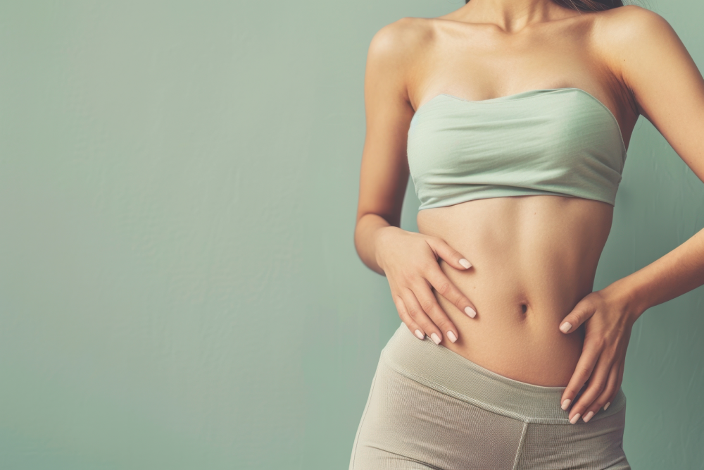 Woman with toned abs after EMSculpt NEO treatment.