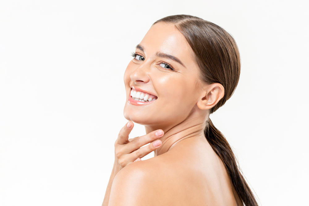 Woman with radiant skin smiling after Botox treatment.