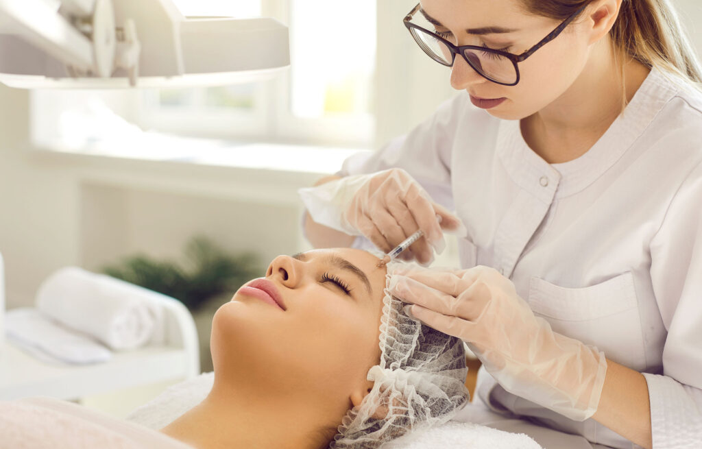 Professional administering Sculptra injection at med spa.